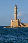 Greece, Crete, Chania harbor, old town. Chania Lighthouse. Art Print